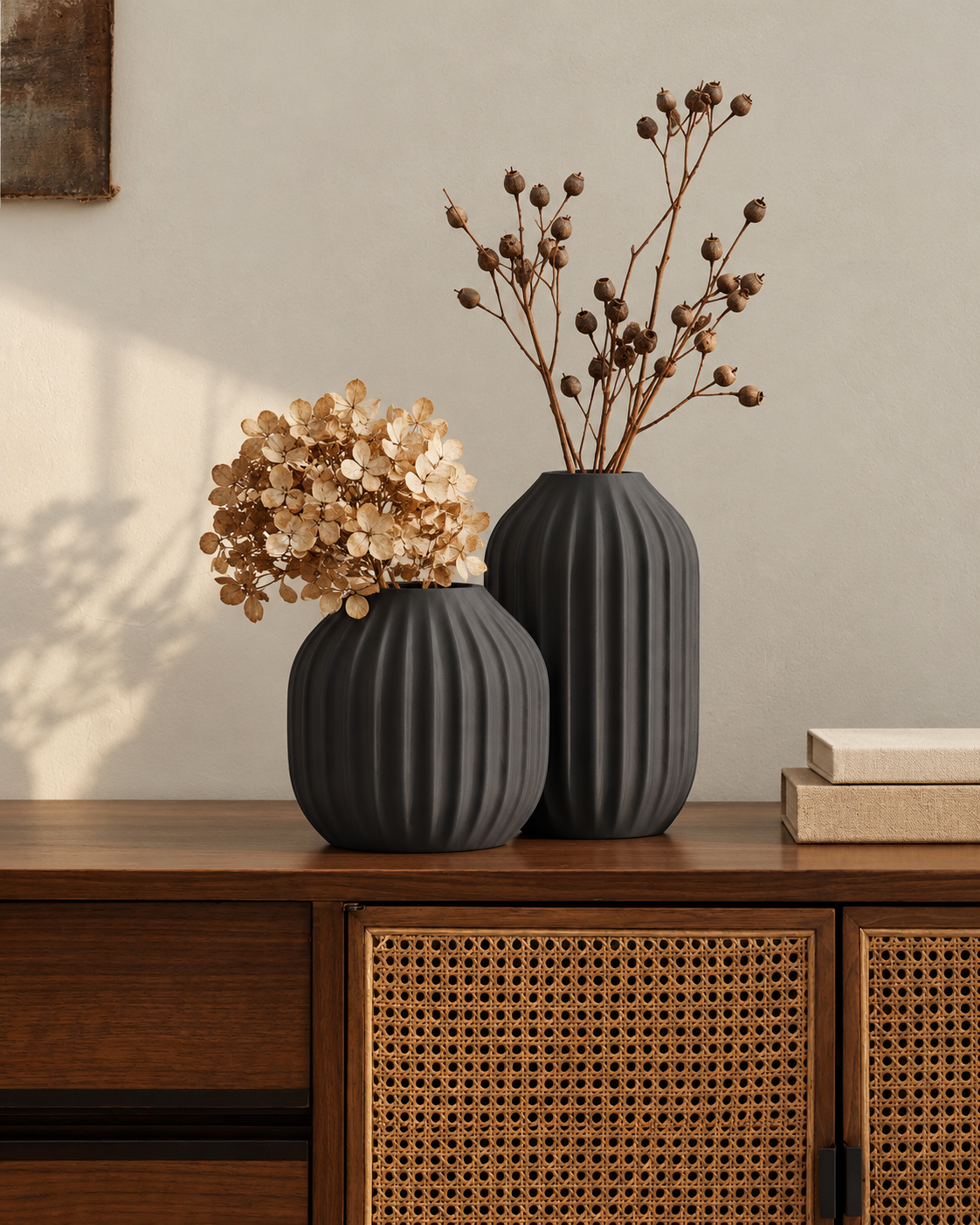 Marama pair of pleated vases, tall and round, in Charcoal, with dried stems, on cane sideboard, LAYR, made in New Zealand