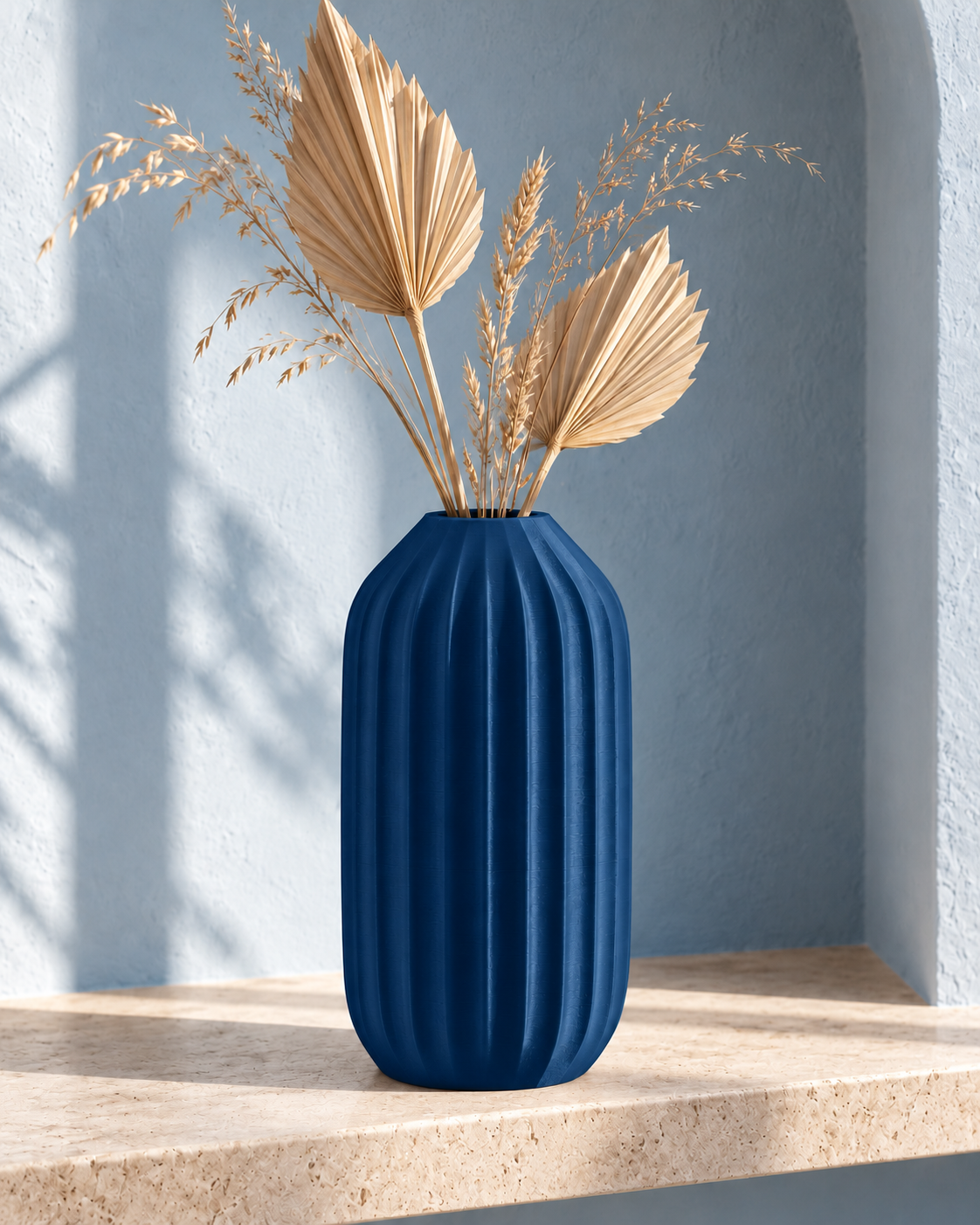 Marama tall pleated vase in Dark Blue, with dried stems, pale blue alcove, LAYR, made in New Zealand