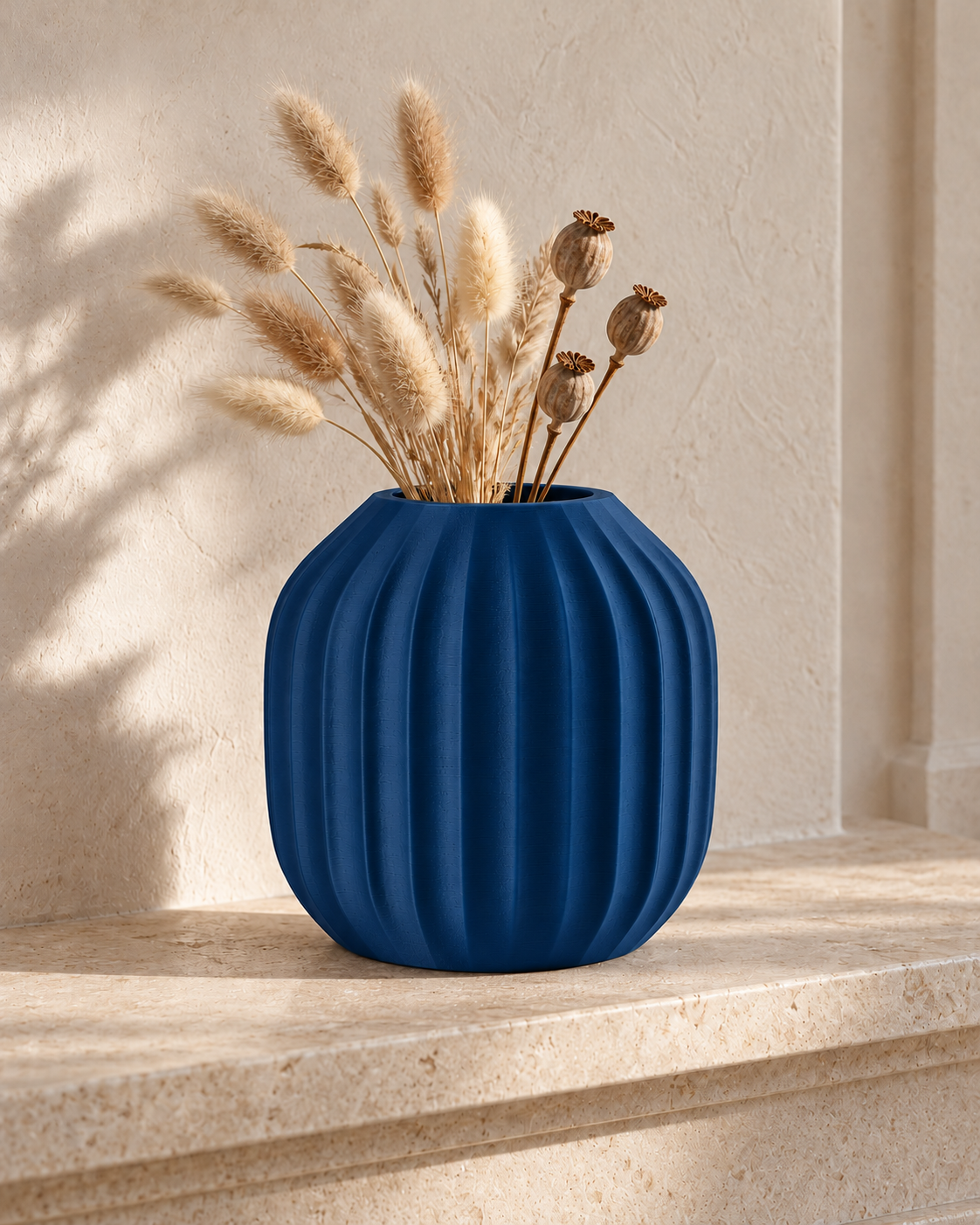 Marama round pleated vase in Dark Blue, with dried stems, limestone hearth, LAYR, made in New Zealand